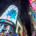 Stocks Settle Sharply Higher as Crude Prices Plunge and Chipmakers Soar